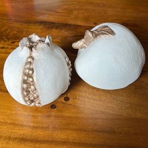 Decorative apple and pomegranate.